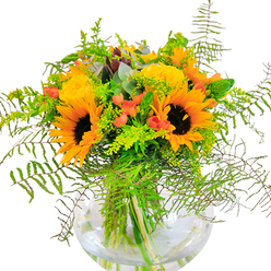 The first impression of this Docklands bouquet is one of pure, sun-drenched exuberance, expertly gathered by a skilled local florist. Bright sunflowers and buttery yellow roses find harmony in a composition that beams with happiness-their layered petals radiating outward in a celebration of light akin to a summer morning on West India Quay. Weaving through the arrangement, deep green foliage and cascading fern fronds suggest the lushness of local green spaces, while clusters of scarlet-hued Hypericum berries glimmer like jewels among gently matt petals. Light green filler, possibly goldenrod, introduces clouds of tiny yellow blossoms and slender spikes, imparting a sense of texture and airiness. Occasional glints of silvery-blue eucalyptus lend further dimension and a faintly herbal aroma. The arrangement's stems are artfully displayed through a crystal-clear, rounded vase, where their submerged forms draw the eye and amplify the bouquet's structural elegance. In close view, one notices the interplay of textures: velvety sunflower faces, the delicate swirl of roses, and the crisp, cool snap of fresh foliage. The overall scent is subtle and lively, evoking open air and waterside breezes. Perfect as a centrepiece for celebrations, birthdays, or simply bringing the golden vibrancy of Docklands into any home, this bouquet is crafted to spark joy in every setting.